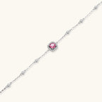 Elegant sterling silver chain bracelet featuring pink moissanite center stone in cushion halo setting with adjustable clasp