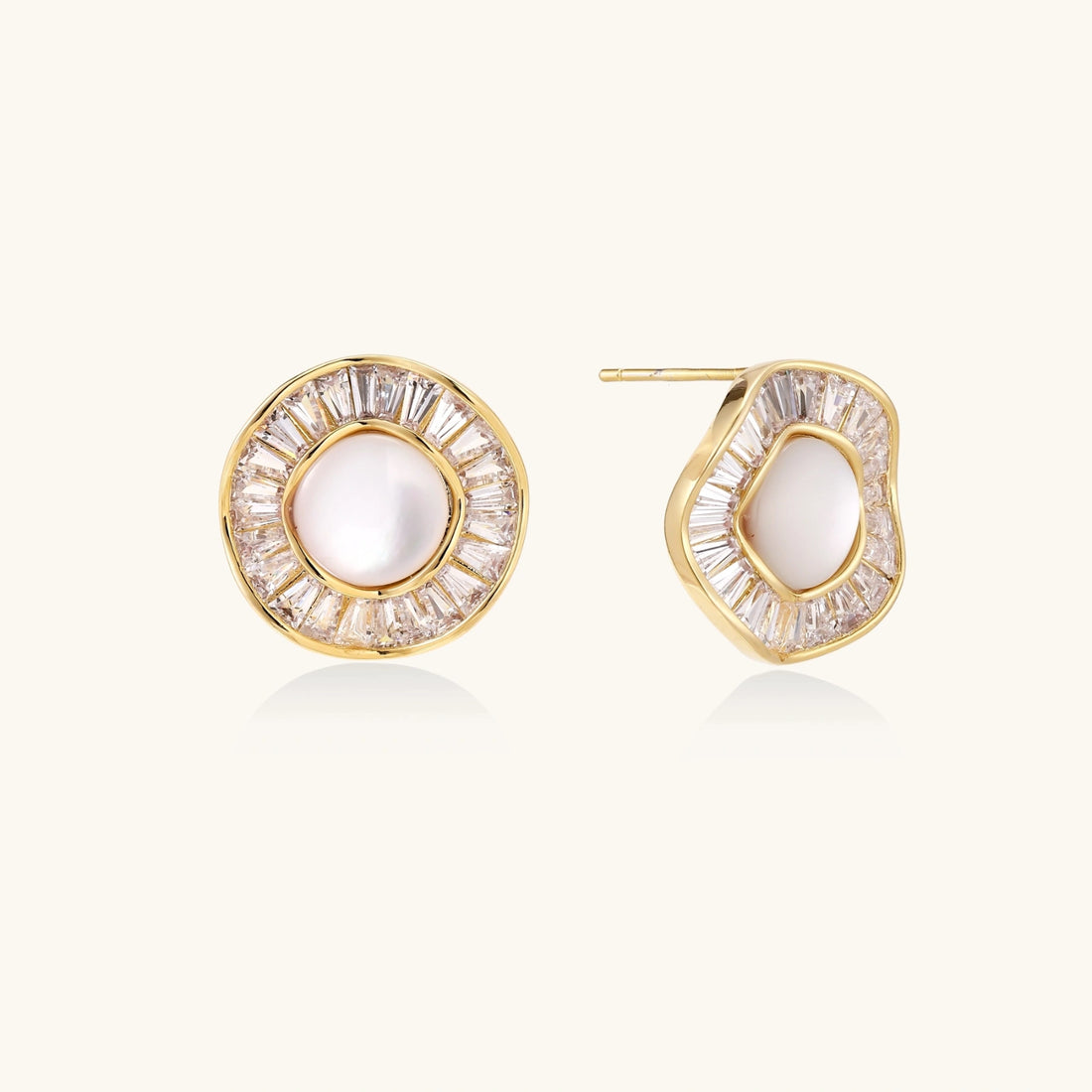 Gold-plated stud earrings with central freshwater pearl surrounded by radiating baguette crystals in sunburst design