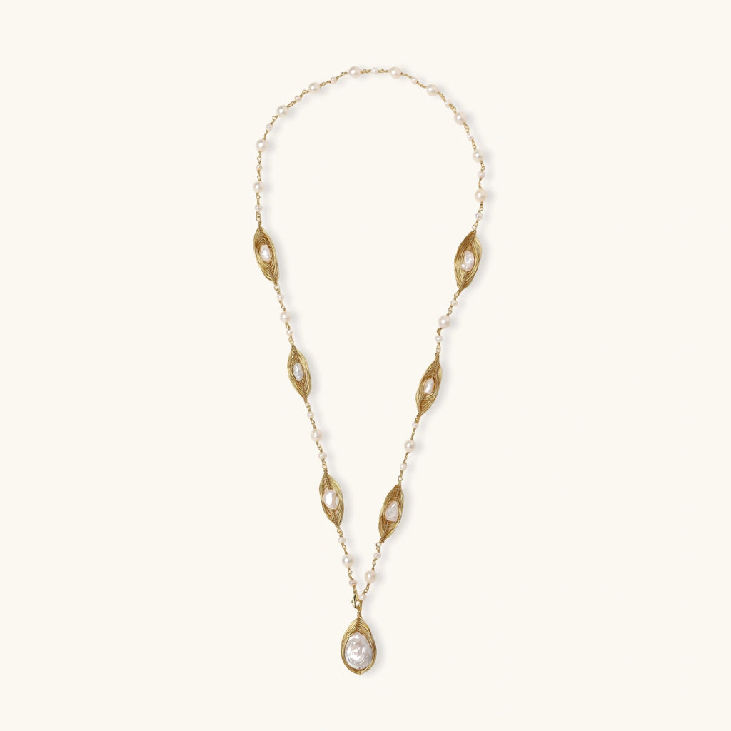 14K gold plated necklace with organic leaf motifs and freshwater pearls arranged in an elegant chain design on neutral background.