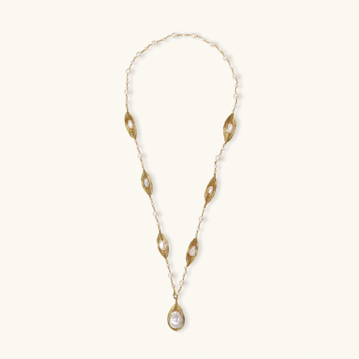 14K gold plated necklace with organic leaf motifs and freshwater pearls arranged in an elegant chain design on neutral background.