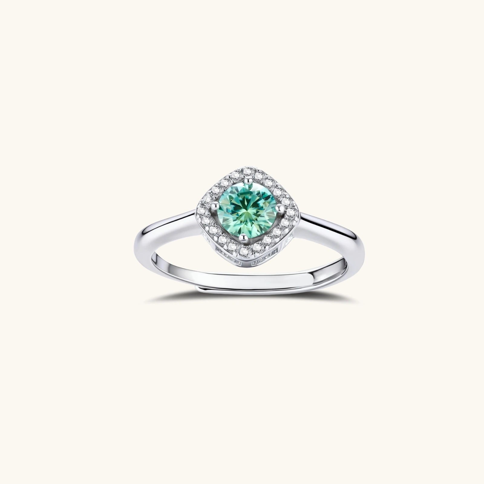 Sterling silver adjustable ring featuring round green moissanite center stone surrounded by clear halo stones