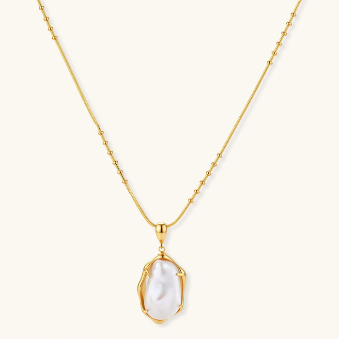 18K gold-plated sterling silver necklace with alternating bead chain and baroque pearl pendant on neutral background.