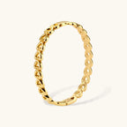 Gold 18K plated stainless steel bangle with continuous open heart links, high-polish finish, on white background.